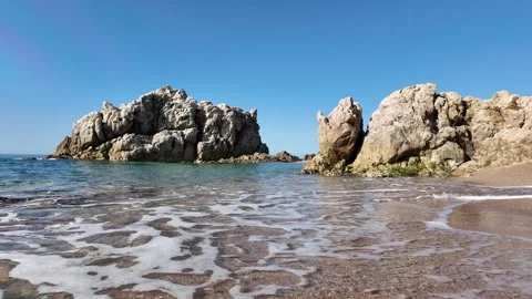 Beautiful sea view on an empty rocky beach with blue sky in Spain, background Stock Footage 277112149