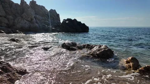 Beautiful sea view on an empty rocky beach with blue sky in Spain, background Stock Footage 277112152