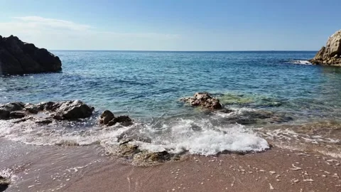Beautiful sea view on an empty rocky beach with blue sky in Spain, background Stock Footage 277112166