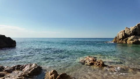 Beautiful sea view on an empty rocky beach with blue sky in Spain, background Stock Footage 277112167