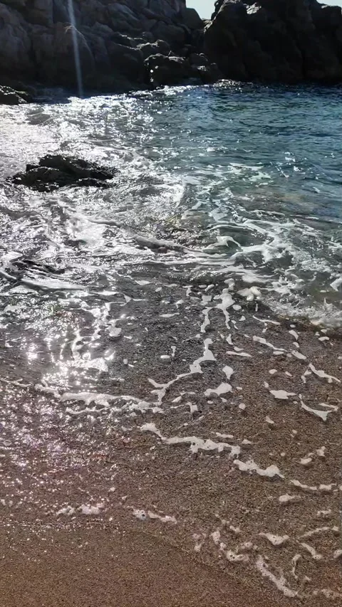 Beautiful sea view on an empty rocky beach with blue sky, vertical background Stock Footage 277148239