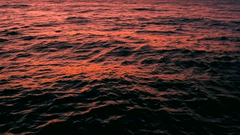 Beautiful sea water waves with reflection of red sunset light. ProRes 422 HQ. Stock Footage 247921100