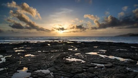 Beautiful seascape at sunset with dramatic clouds landscape image Stock Photos