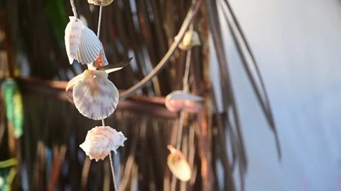 Beautiful seashells mobile decoration hanging with wind blowing, slowmotion.. Stock Footage 246899456