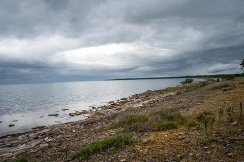 A beautiful seashore with a dramatic sky in the background Stock Photos