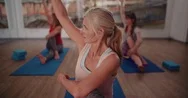 Beautiful Senior Woman Stretching Her Arms During Yoga Class Stock Footage