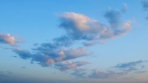 A Beautiful Serene Cloudscape at Dusk with a Soft Blue Sky That Evokes Peacefuln Stock Photos