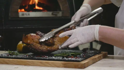 Beautiful serving of New Year's dishes.Appetizing christmas duck with apples Stock Footage 119936037
