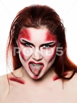 Beautiful sexy devil girl with professional make-up. Fashion Art design Stock Photos