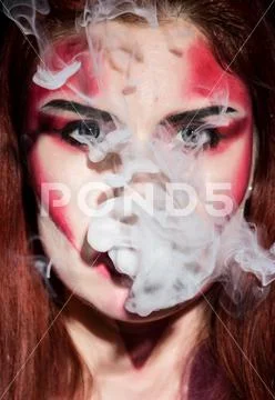 Beautiful sexy devil girl with professional make-up. Fashion Art design Stock Photos