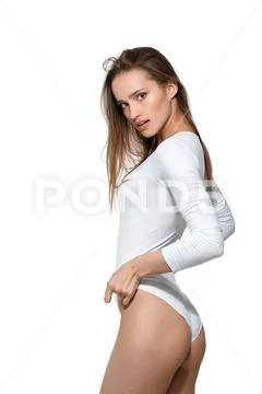 Beautiful Woman with Perfect Body in White Bodysuit Stock Photo