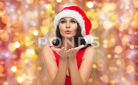 Beautiful sexy woman in santa hat and red dress Stock Photos