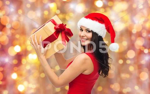 Beautiful sexy woman in santa hat with gift box Stock Photos