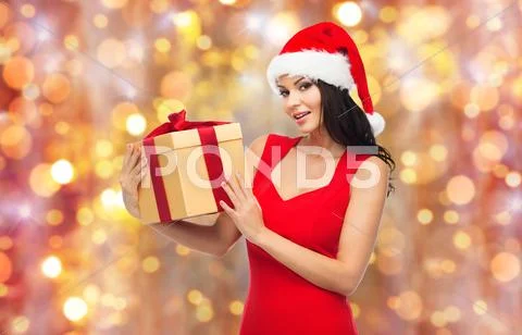 Beautiful sexy woman in santa hat with gift box Stock Photos