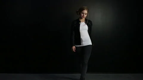 Beautiful sexy young girl posing in the studio on a black background Stock Footage 61807053