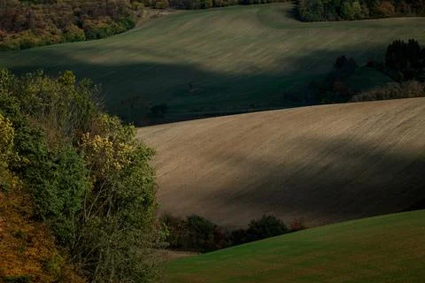 A beautiful shadow play in the undulating fields Stock Photos