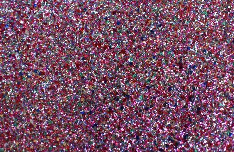 Beautiful shiny multi-colored background of sequins. Colorful glitter. Stock Photos