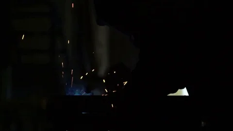 Beautiful shooting of welding. The worker welds details of an iron design. Slow Stock Footage 81517134