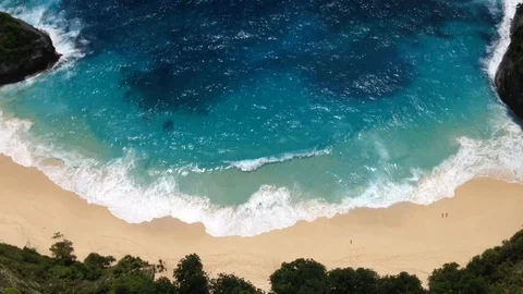 Beautiful Shot Of Deep Blue Waves Crashing Against Rock Cliff, Bali, Indonesia Stock Footage 115915288