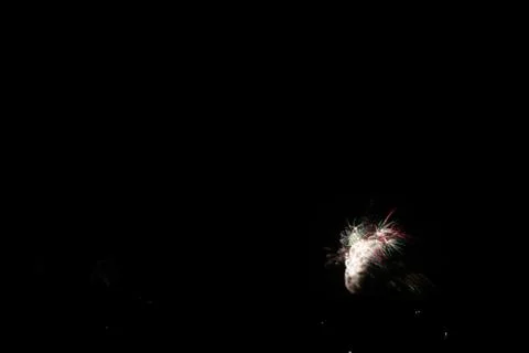 Beautiful shot of exploding colorful fireworks on a black night sky backgroun Stock Photos