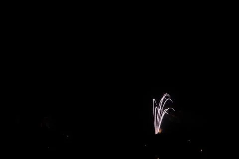 Beautiful shot of exploding colorful fireworks on a black night sky backgroun Stock Photos