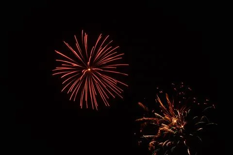 Beautiful shot of exploding colorful fireworks in a black night sky Stockfoto's