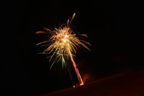 Beautiful shot of exploding colorful fireworks in a black night sky Stock Photos