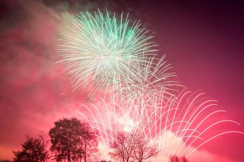 Beautiful shot of exploding colorful fireworks in a night sky over Heaton Park Stock Photos