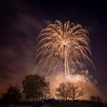 Beautiful shot of exploding colorful fireworks in a night sky over Heaton Park Stock Photos