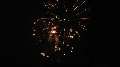 Beautiful shot of exploding fireworks in a black night sky Stock Photos