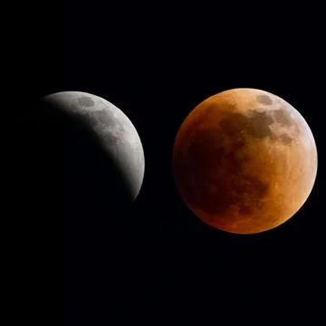 Beautiful shot of a gray eclipse moon and a blood moon in a night sky Fotos Stock