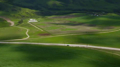 Beautiful shot of shadows of clouds run above green valley hill. Calmness nature Stock Footage 261205456