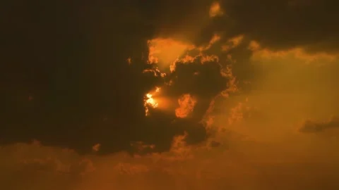 Beautiful shot of sunset behind clouds with silver lining and rays in rural  Stock Footage 210852108