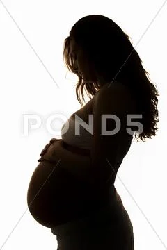 Beautiful silhouette of a pregnant girl Stock-Fotos