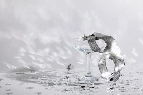 Beautiful silver carnival mask, empty glass and confetti on white background Stock Photos
