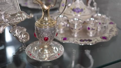 Beautiful silver tea set display in a glass cabinet Stock Footage 341456405