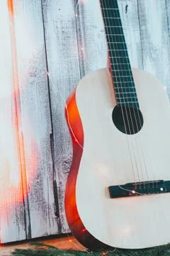 Beautiful six string classical guitar on wooden background Stock Photos