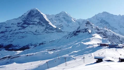 A beautiful ski area in the foreground, eiger, mönch and jungfrau in the Stock Footage 146639862