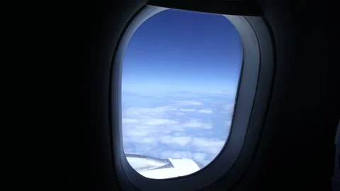 A beautiful sky and clouds passing by view from the airplane. Stock Footage 131357055