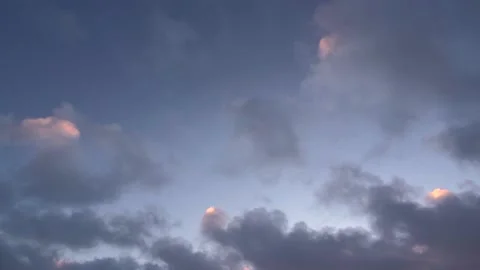 A beautiful sky background with bits of pink cloud Vídeo Stock 233684665