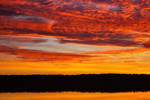 Beautiful sky background with clouds after sunset. Red yellow sky. Foto stock
