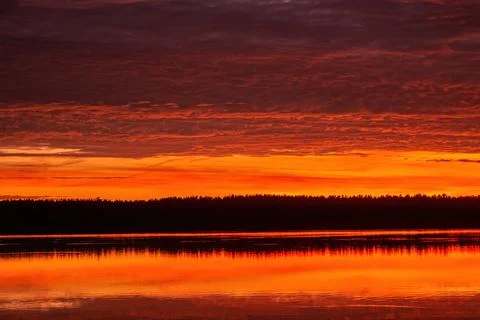 Beautiful sky background with clouds after sunset. Red yellow sky Stock Photos