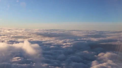 Beautiful sky with clouds behind an airplane Stockbeeldmateriaal 59517031