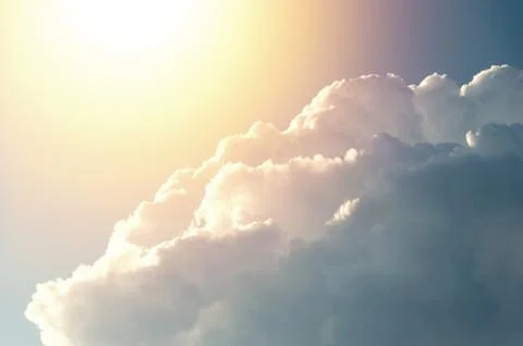 Beautiful sky with clouds, due to which the sun and rays are visible. Stock Photos