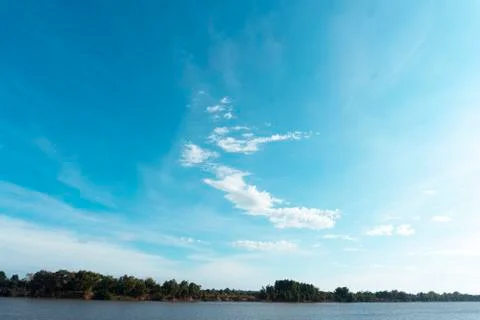 Beautiful sky clouds over the river. Stock Photos
