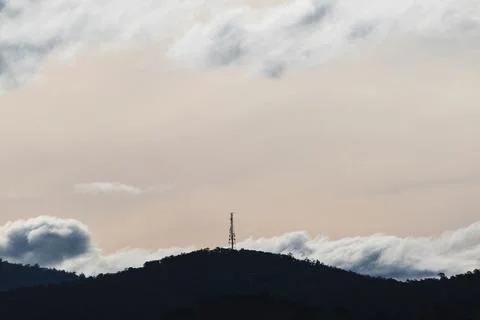 Beautiful sky with clouds rolling over the mountains in Tasmania, Australia Stock Photos