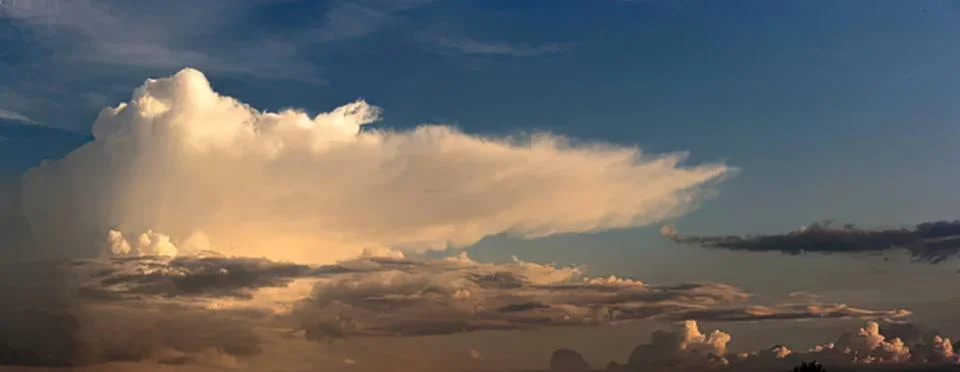 Beautiful sky with large white clouds during sunset Stock Photos