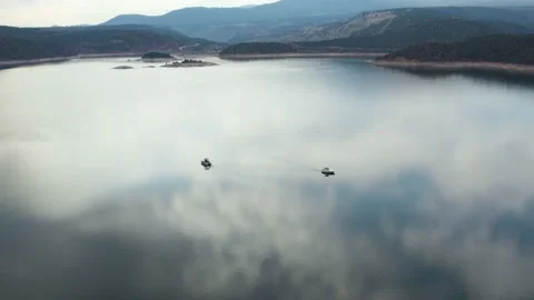 Beautiful Sky Reflection On Lake Water Surface With Boats At Flaming Gorge Stock Footage 205851526