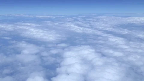 A beautiful sky view from aircraft window covered with white clouds sheet. Stock Footage 131357059