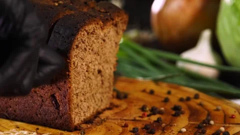 Beautiful sliced ​​rye bread on a board Stock Footage 259818328